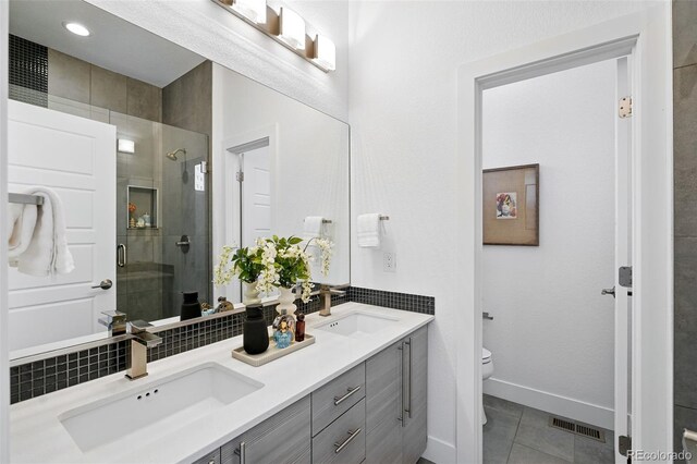 2830 W 32nd Ave, Denver, CO 80211 - bathroom featuring double vanity, a shower stall, and tile patterned flooring