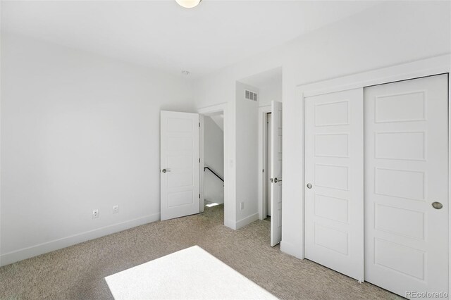 2830 W 32nd Ave, Denver, CO 80211 - unfurnished bedroom featuring light carpet and a closet