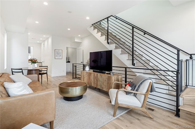 2012 W 46th Ave, Denver, CO 80211 - living area featuring wood finished floors, recessed lighting, stairway, and baseboards