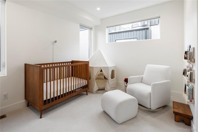2012 W 46th Ave, Denver, CO 80211 - carpeted bedroom with baseboards, a crib, and recessed lighting