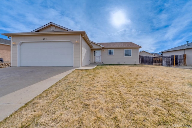 ranch-style home featuring a garage and a front lawn