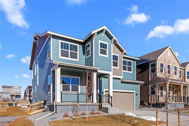 view of front of house featuring a garage, a residential view, a porch, and concrete driveway