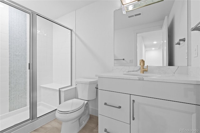 bathroom featuring a stall shower, visible vents, toilet, tile patterned floors, and vanity