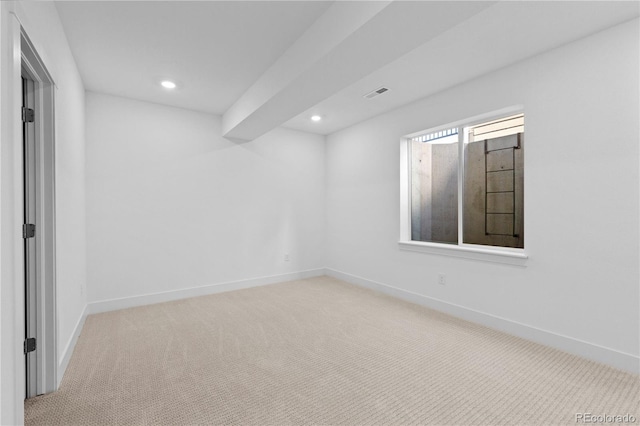 carpeted spare room with recessed lighting, visible vents, and baseboards