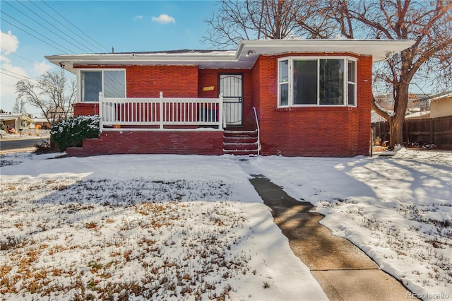 2200 W Moffat Pl, Denver, CO 80221 - view of front of house featuring brick siding and covered porch