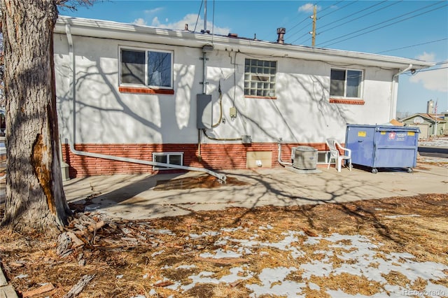 rear view of property with a patio and central AC unit