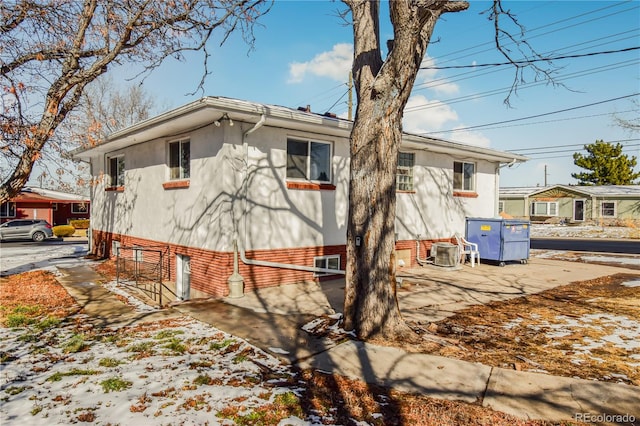 view of property exterior with a patio area and central air condition unit