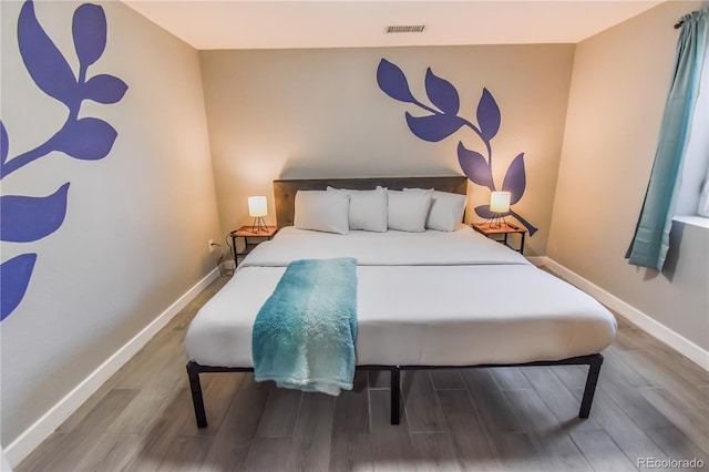 bedroom featuring wood-type flooring