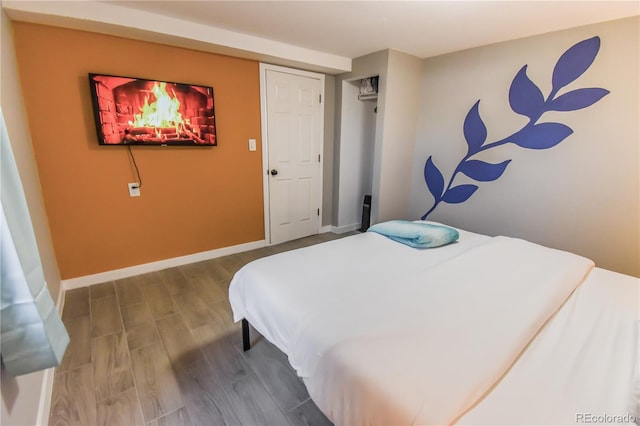 bedroom with wood-type flooring