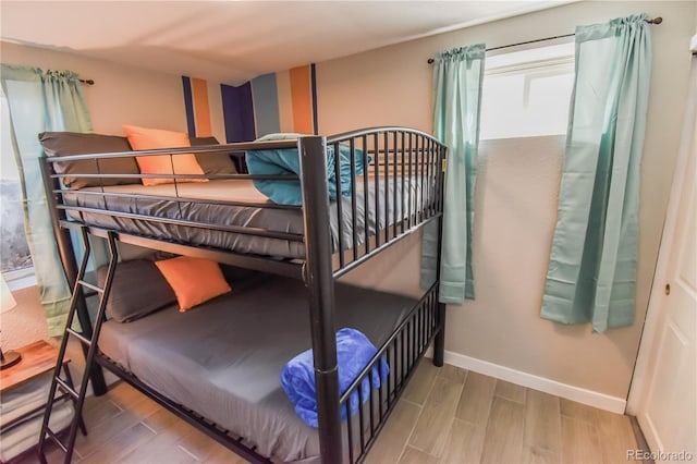 2200 W Moffat Pl, Denver, CO 80221 - bedroom featuring wood finished floors and baseboards