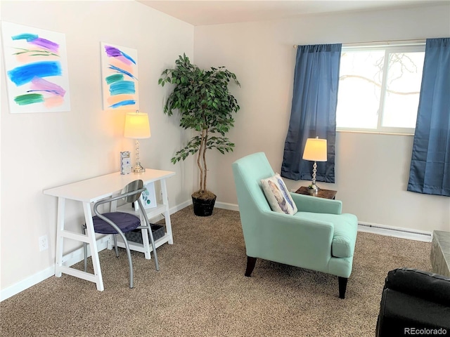 sitting room featuring a baseboard heating unit and carpet