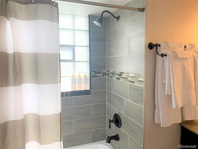 bathroom with shower / bathtub combination with curtain