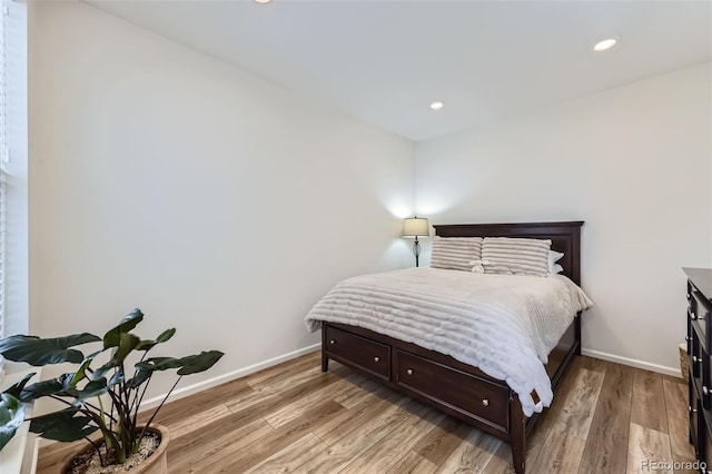 bedroom featuring recessed lighting, light wood-style flooring, and baseboards