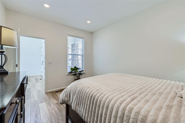 bedroom featuring recessed lighting, baseboards, and light wood finished floors