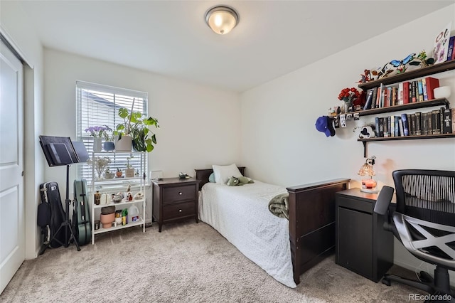 bedroom featuring light colored carpet