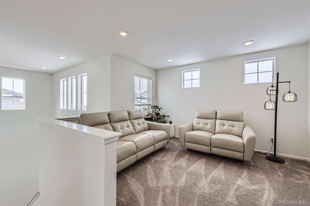 living area with baseboards, carpet floors, and recessed lighting