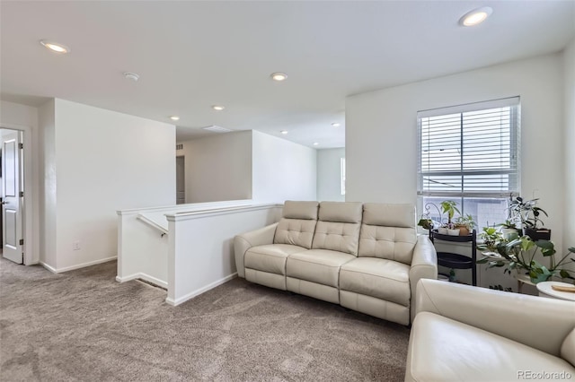 living area featuring light carpet, baseboards, and recessed lighting