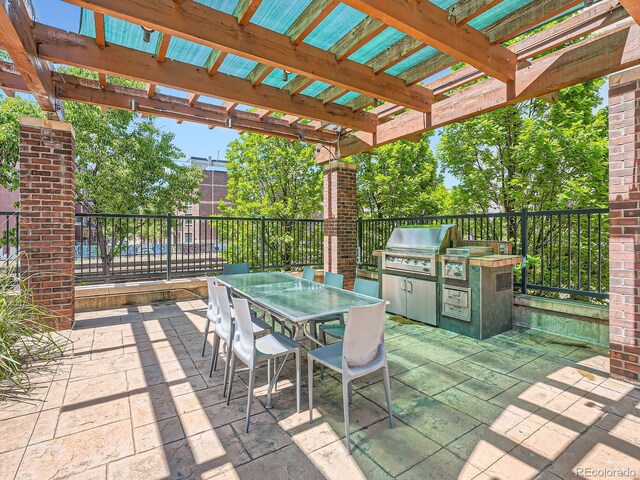 1401 Delgany St Unit 409, Denver, CO 80202 - view of patio with outdoor dining area and a pergola