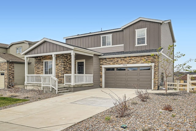 5256 Trails Edge Ln, Castle Rock, CO 80104 - craftsman house featuring board and batten siding, driveway, stone siding, and covered porch