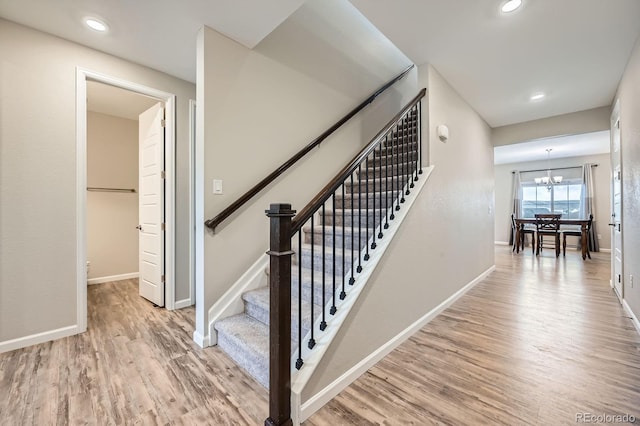 5256 Trails Edge Ln, Castle Rock, CO 80104 - staircase with baseboards, an inviting chandelier, and wood finished floors