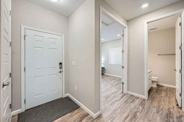 5256 Trails Edge Ln, Castle Rock, CO 80104 - foyer entrance featuring baseboards, light wood-style flooring, and visible vents