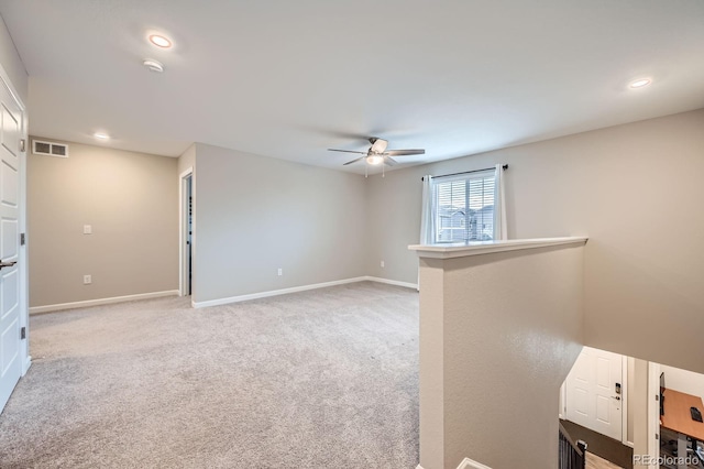 5256 Trails Edge Ln, Castle Rock, CO 80104 - unfurnished room featuring light colored carpet, ceiling fan, visible vents, and baseboards