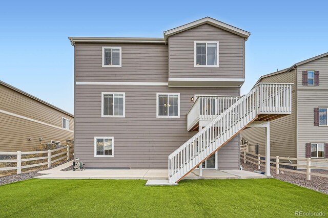 5256 Trails Edge Ln, Castle Rock, CO 80104 - rear view of property with a yard, a patio, a fenced backyard, and stairs