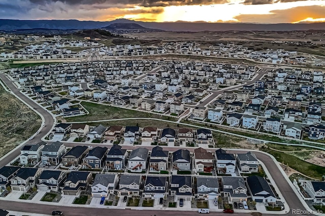 5256 Trails Edge Ln, Castle Rock, CO 80104 - aerial view at dusk featuring a mountain view and a residential view