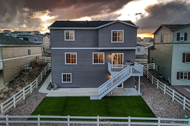5256 Trails Edge Ln, Castle Rock, CO 80104 - back of house featuring a wooden deck, a patio, a fenced backyard, stairs, and a yard