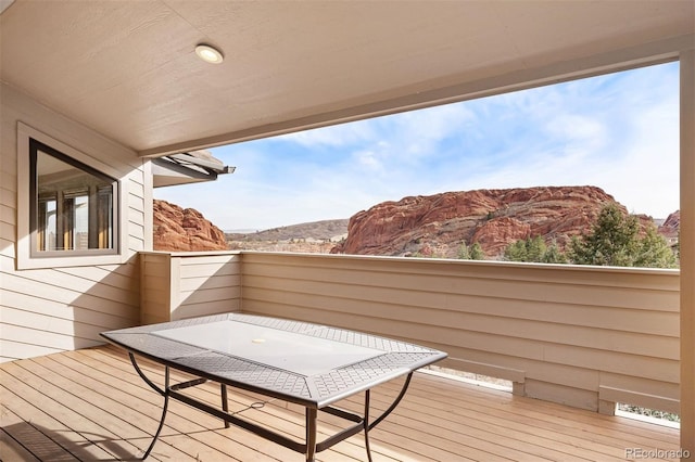 wooden deck featuring a mountain view