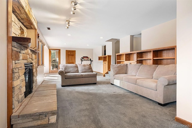 carpeted living room with a fireplace