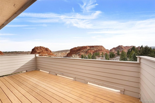 wooden terrace featuring a mountain view