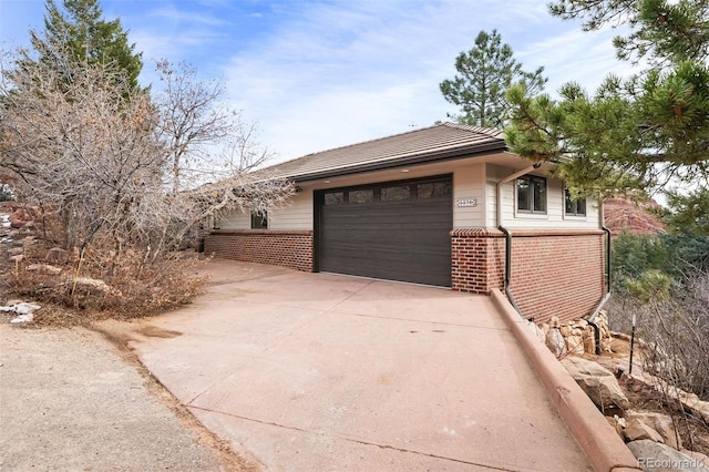 view of property exterior with a garage