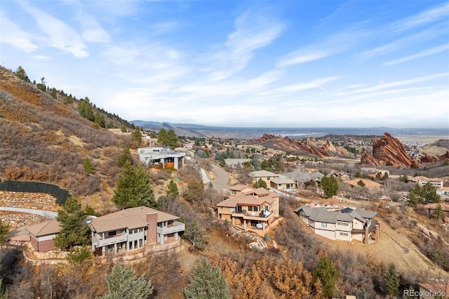 birds eye view of property featuring a mountain view