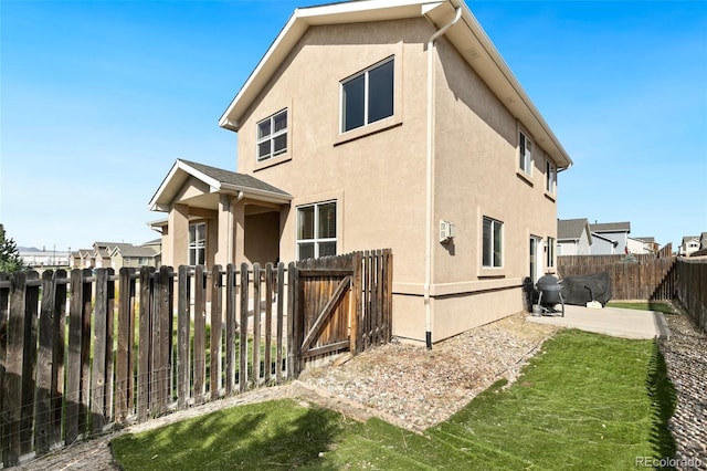 rear view of house with a patio area