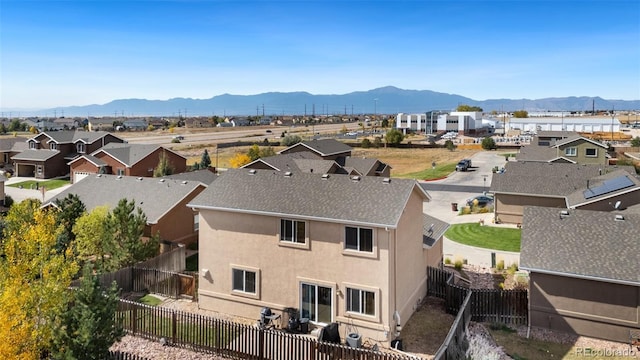 birds eye view of property featuring a mountain view