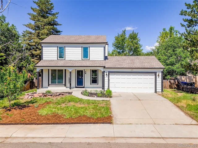 655 Gooseberry Ct, Lafayette, CO 80026 - traditional home with covered porch, an attached garage, driveway, and roof with shingles