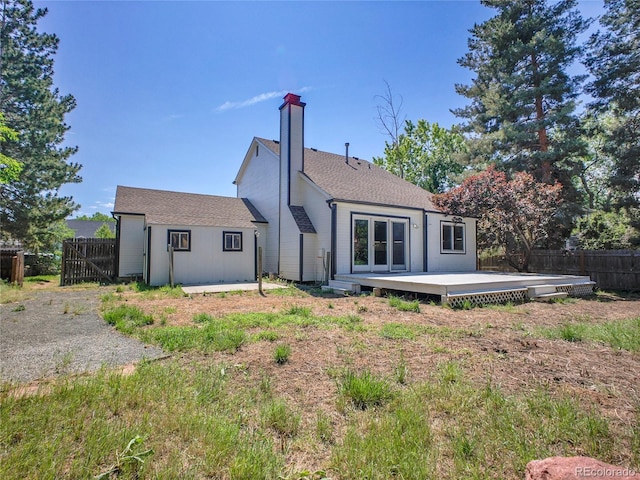 655 Gooseberry Ct, Lafayette, CO 80026 - rear view of property featuring a wooden deck, a chimney, and roof with shingles