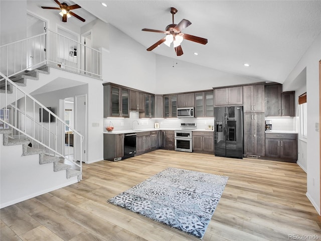 655 Gooseberry Ct, Lafayette, CO 80026 - kitchen featuring black appliances, a ceiling fan, high vaulted ceiling, dark brown cabinets, and recessed lighting