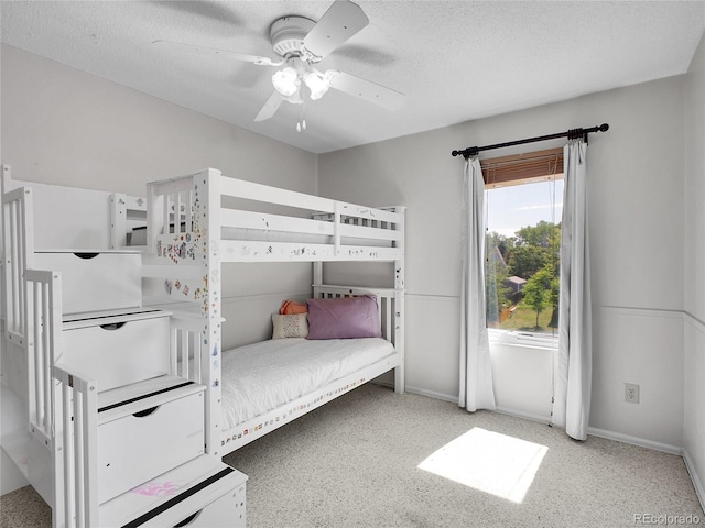 655 Gooseberry Ct, Lafayette, CO 80026 - carpeted bedroom with a textured ceiling and ceiling fan