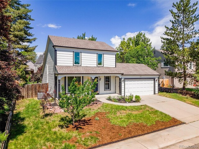 655 Gooseberry Ct, Lafayette, CO 80026 - traditional-style home featuring an attached garage, driveway, covered porch, and a shingled roof