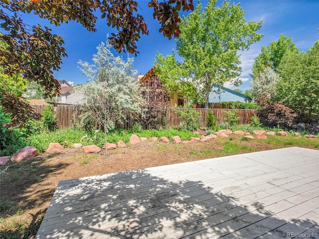 655 Gooseberry Ct, Lafayette, CO 80026 - fenced backyard with a wooden deck
