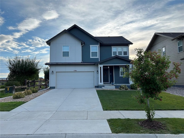 12901 Crane River Dr, Longmont, CO 80504 - view of front of house featuring a front yard, an attached garage, fence, and concrete driveway