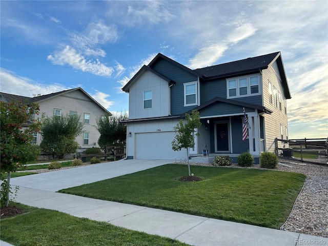 12901 Crane River Dr, Longmont, CO 80504 - traditional home featuring an attached garage, board and batten siding, fence, a front lawn, and driveway