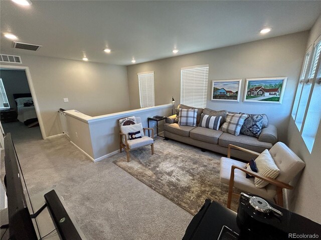 12901 Crane River Dr, Longmont, CO 80504 - carpeted living area with baseboards, visible vents, and recessed lighting