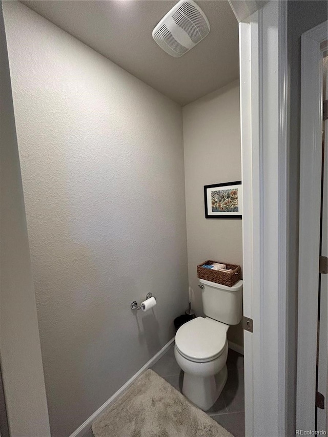 12901 Crane River Dr, Longmont, CO 80504 - bathroom with toilet, tile patterned floors, baseboards, and visible vents