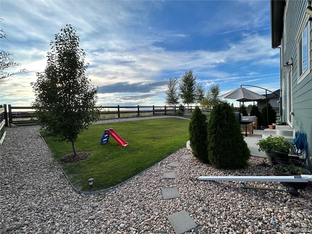 12901 Crane River Dr, Longmont, CO 80504 - view of yard with a patio area and a fenced backyard