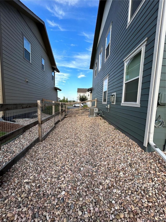 12901 Crane River Dr, Longmont, CO 80504 - view of home's exterior with central air condition unit and fence