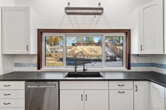 kitchen with white cabinetry, stainless steel dishwasher, and sink