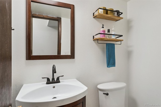 bathroom with toilet and sink